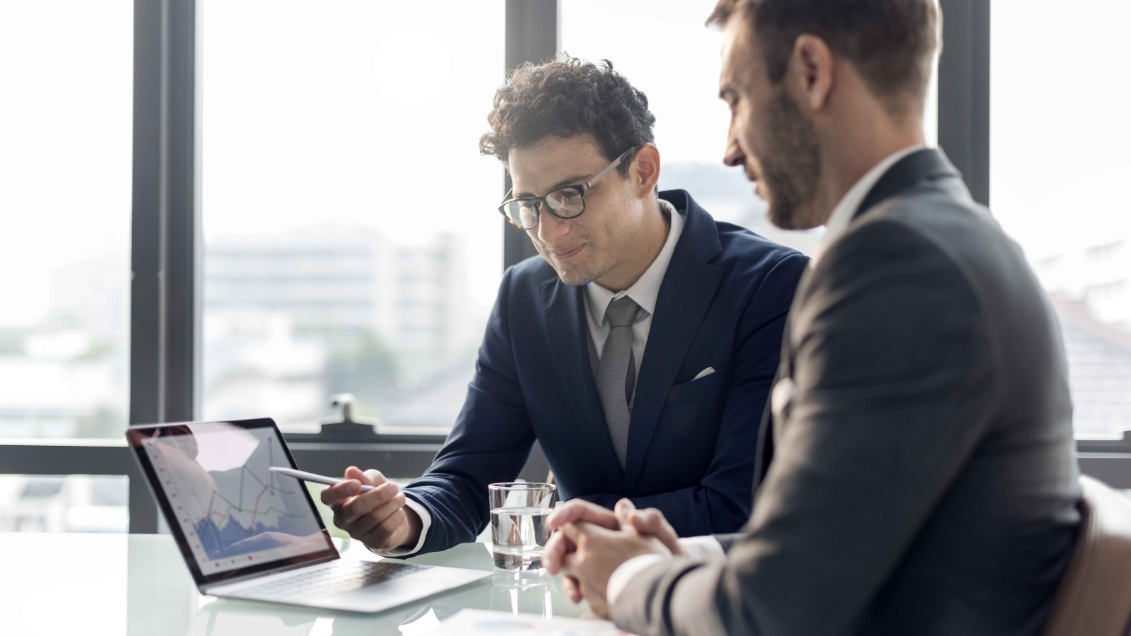 Investment management professionals discussing research processes in a Perthshire Insights article on AI implementation challenges.